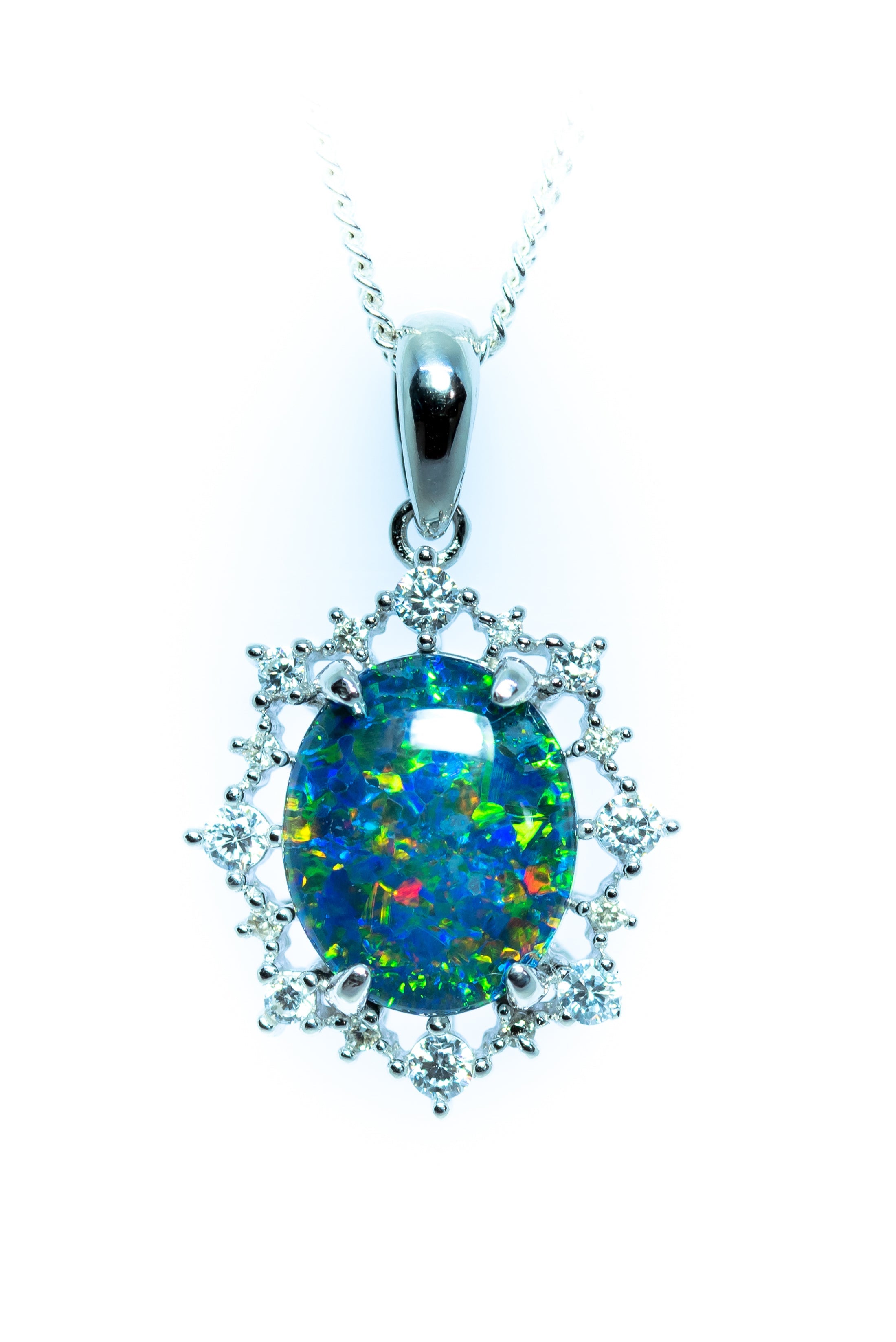 Opal pendant with diamond accents on a white background