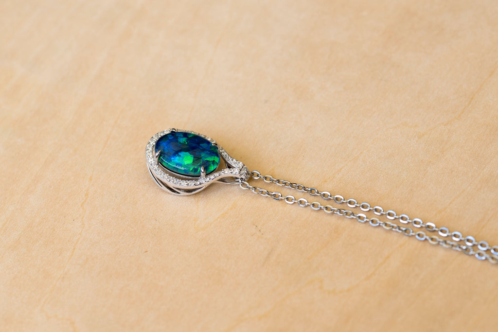 Necklace with an opal pendant on a beige background