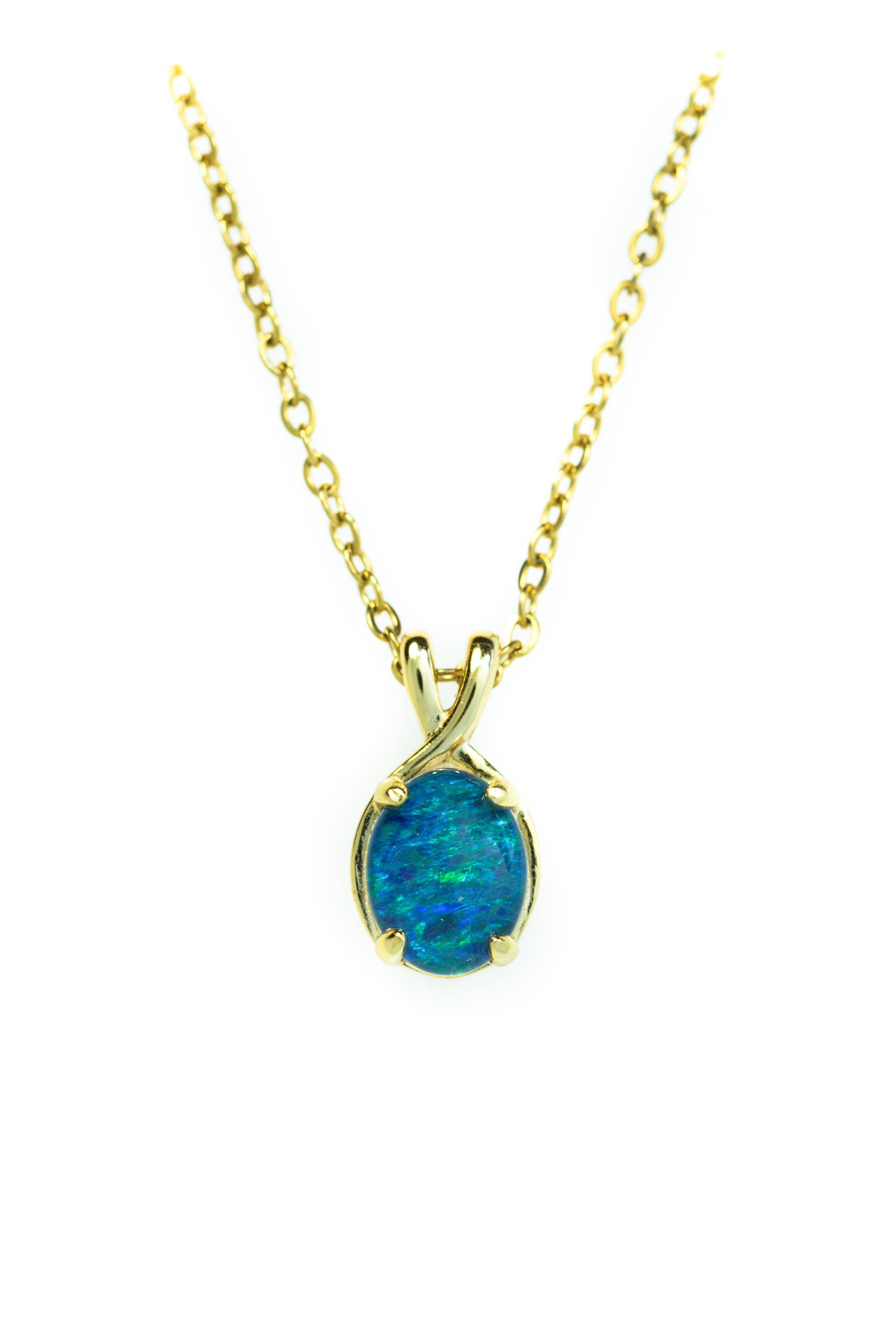 Gold necklace with a blue opal pendant on a white background