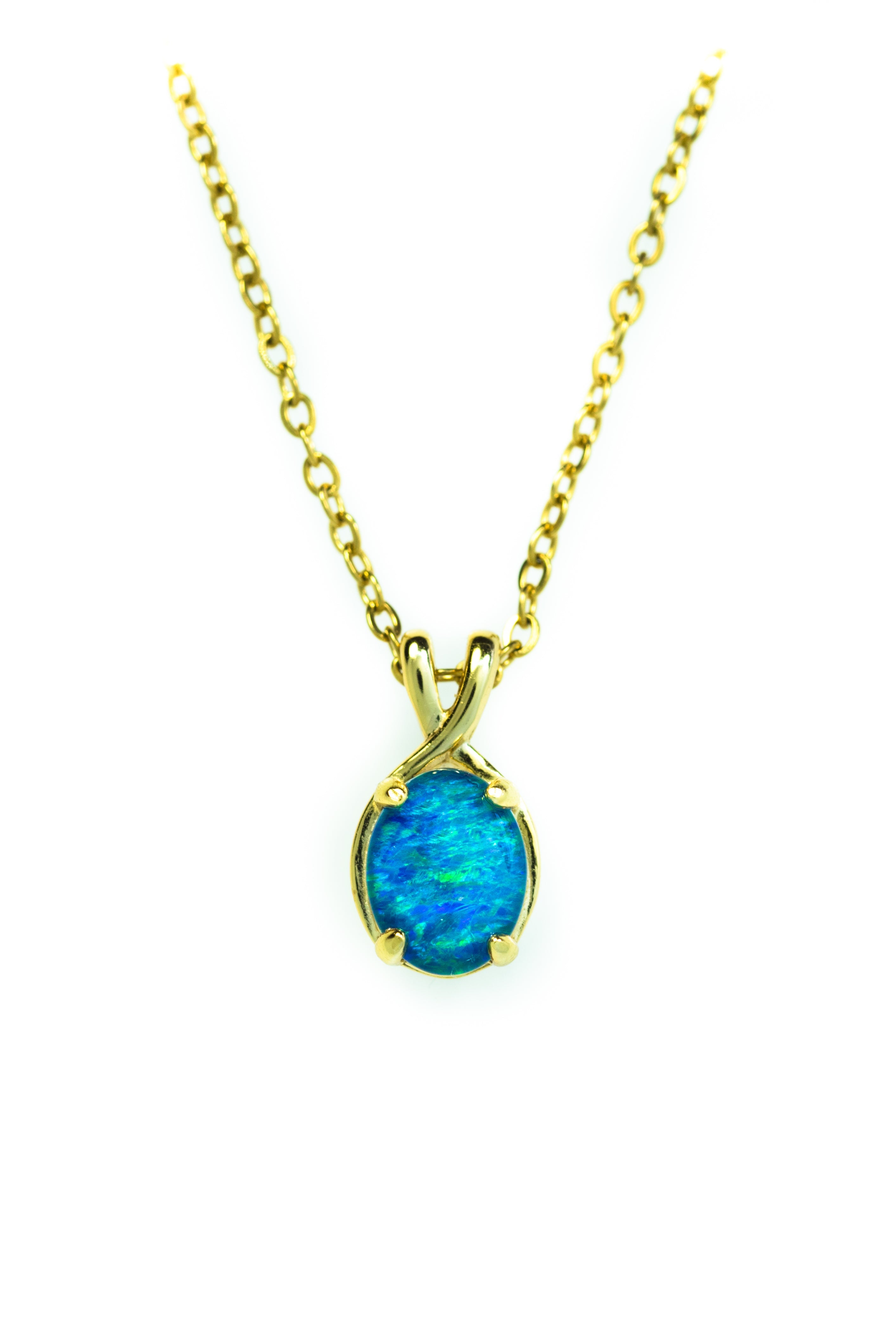 Gold necklace with a blue opal pendant on a white background