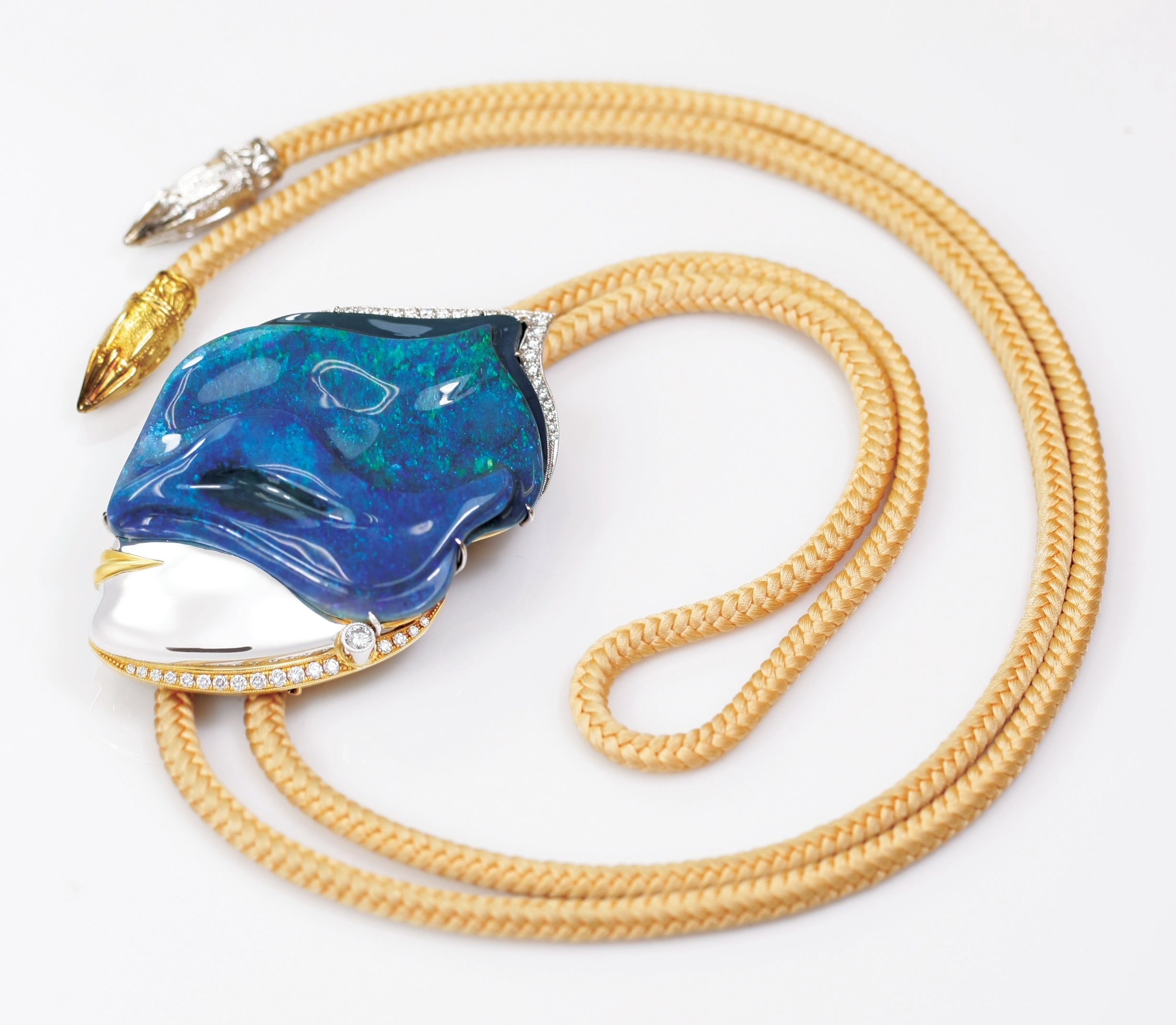 opal Necklace with a blue pendant and gold accents on a white background